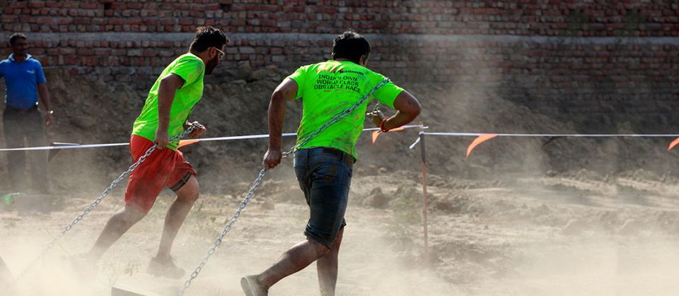 Cinder Block Drag obstacle at a Desi Warrior event